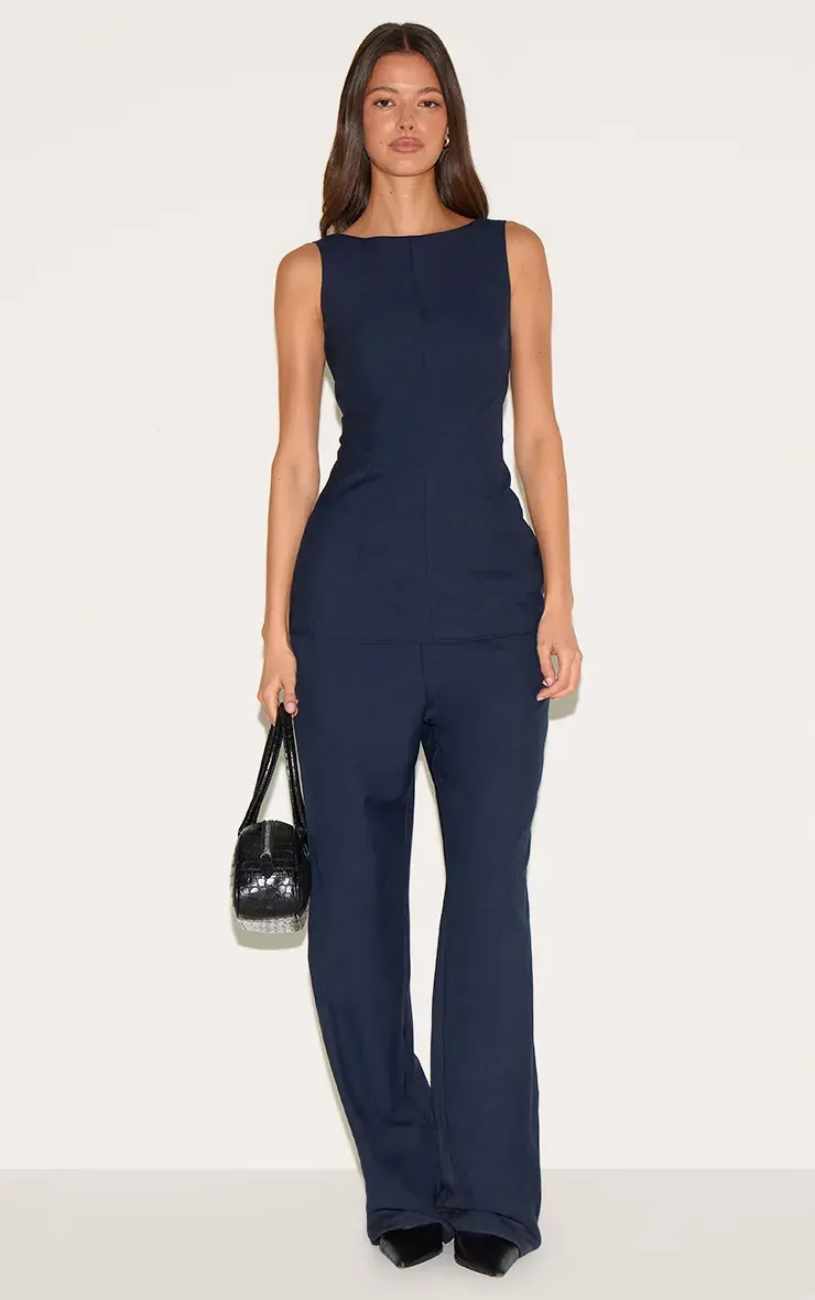 indigo blue tailored woven boat neck longline jumpsuit features a sleeveless design and wide leg trousers